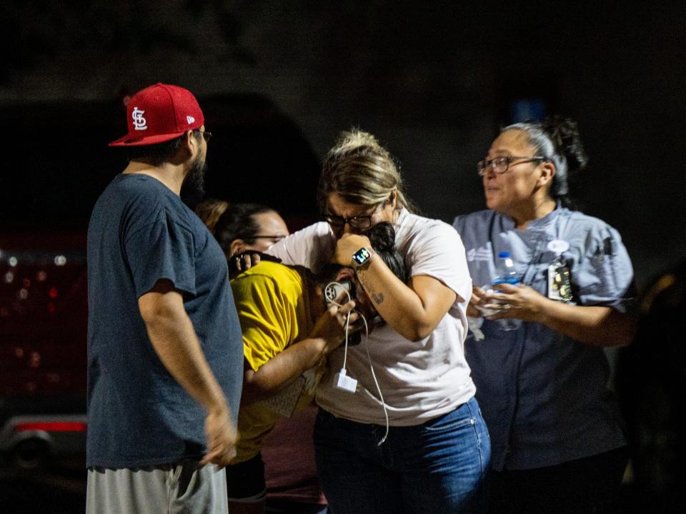 A family grieves outside of the SSGT Willie de Leon Civic Center following the mass shooting at Robb Elementary School on May 24, 2022 in Uvalde, Texas.