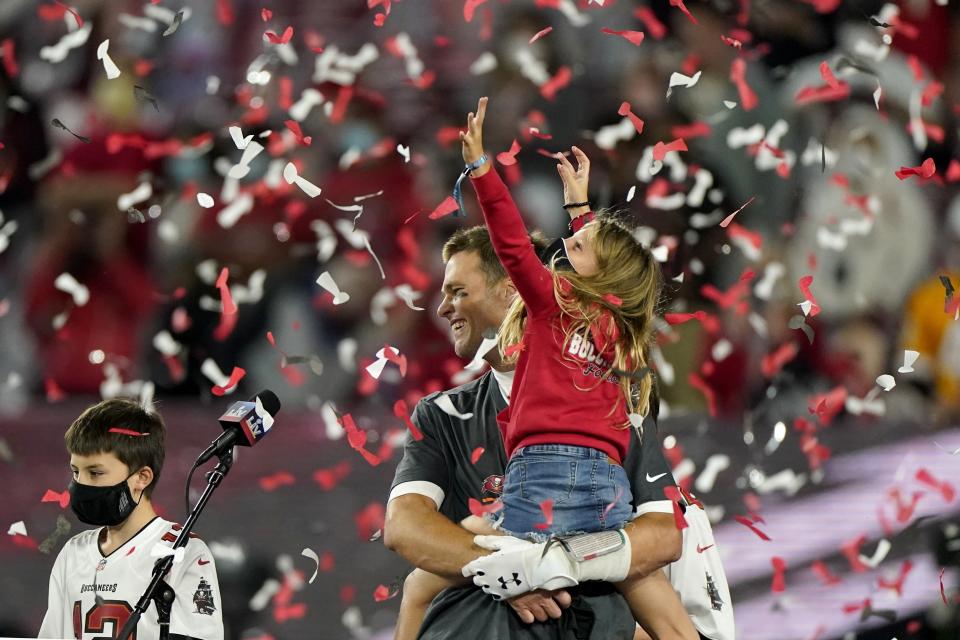 Tampa Bay Buccaneers quarterback Tom Brady celebrates with his family after their NFL Super Bowl 55 football game against the Kansas City Chiefs, Sunday, Feb. 7, 2021, in Tampa, Fla. The Buccaneers defeated the Chiefs 31-9 to win the Super Bowl. (AP Photo/Gregory Bull)