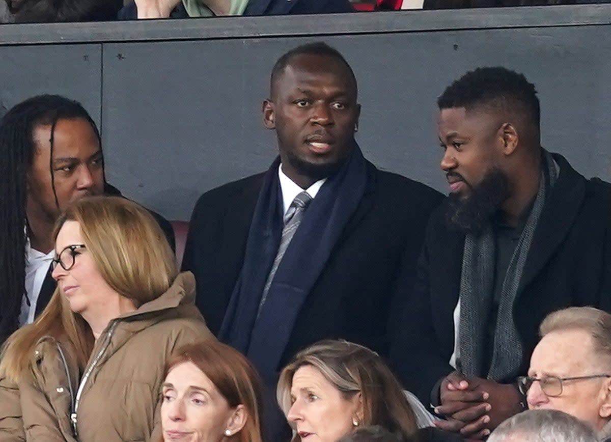 Usain Bolt watches on as Manchester United defeat Fulham in the FA Cup  (PA)