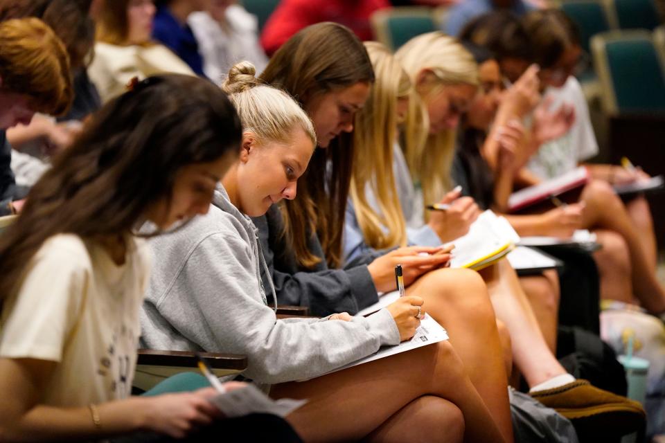 Midland Park High School students fill out voter registration forms after a presentation by Bergen County Clerk John Hogan (not pictured) on Thursday, June 1, 2023, in Midland Park.