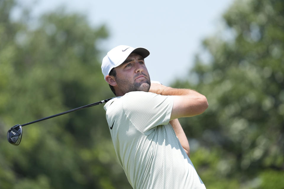 Scottie Scheffler hits a tee shot on the third hole during the final round of the Charles Schwab Challenge golf tournament at Colonial Country Club in Fort Worth, Texas, Sunday, May 26, 2024. (AP Photo/LM Otero)