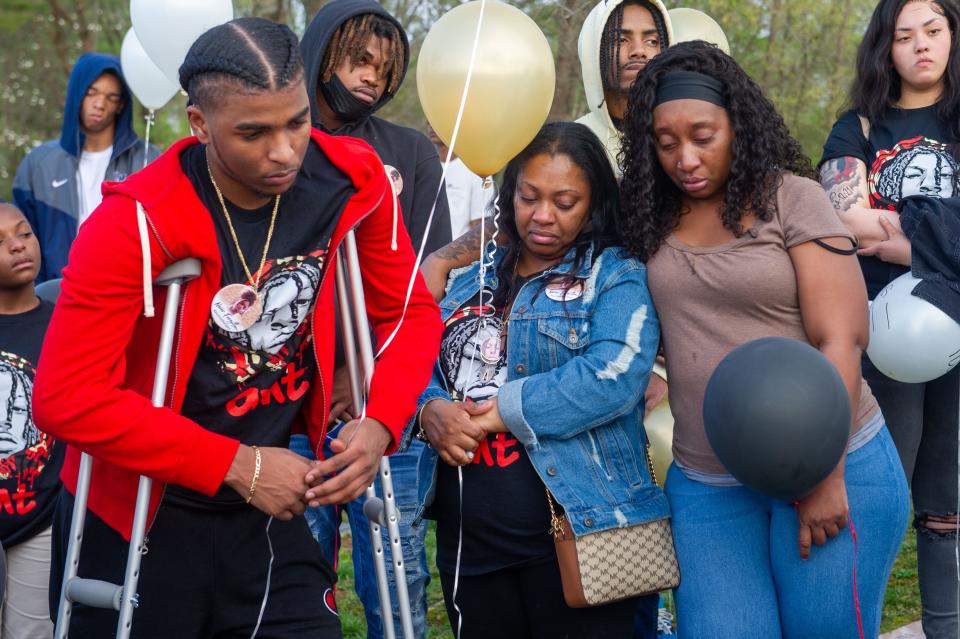 Friends and family mourn during Anthony Thompson Jr.'s "angelversary" at Mount Olive Cemetery in Knoxville earlier this year.
