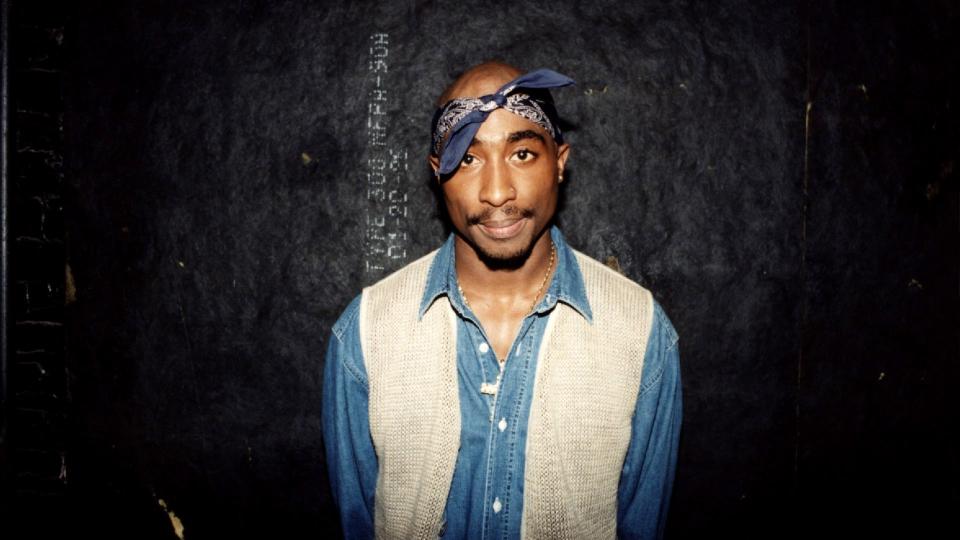 Rapper Tupac Shakur poses for photos backstage after his performance at the Regal Theater in Chicago, Illinois in March 1994