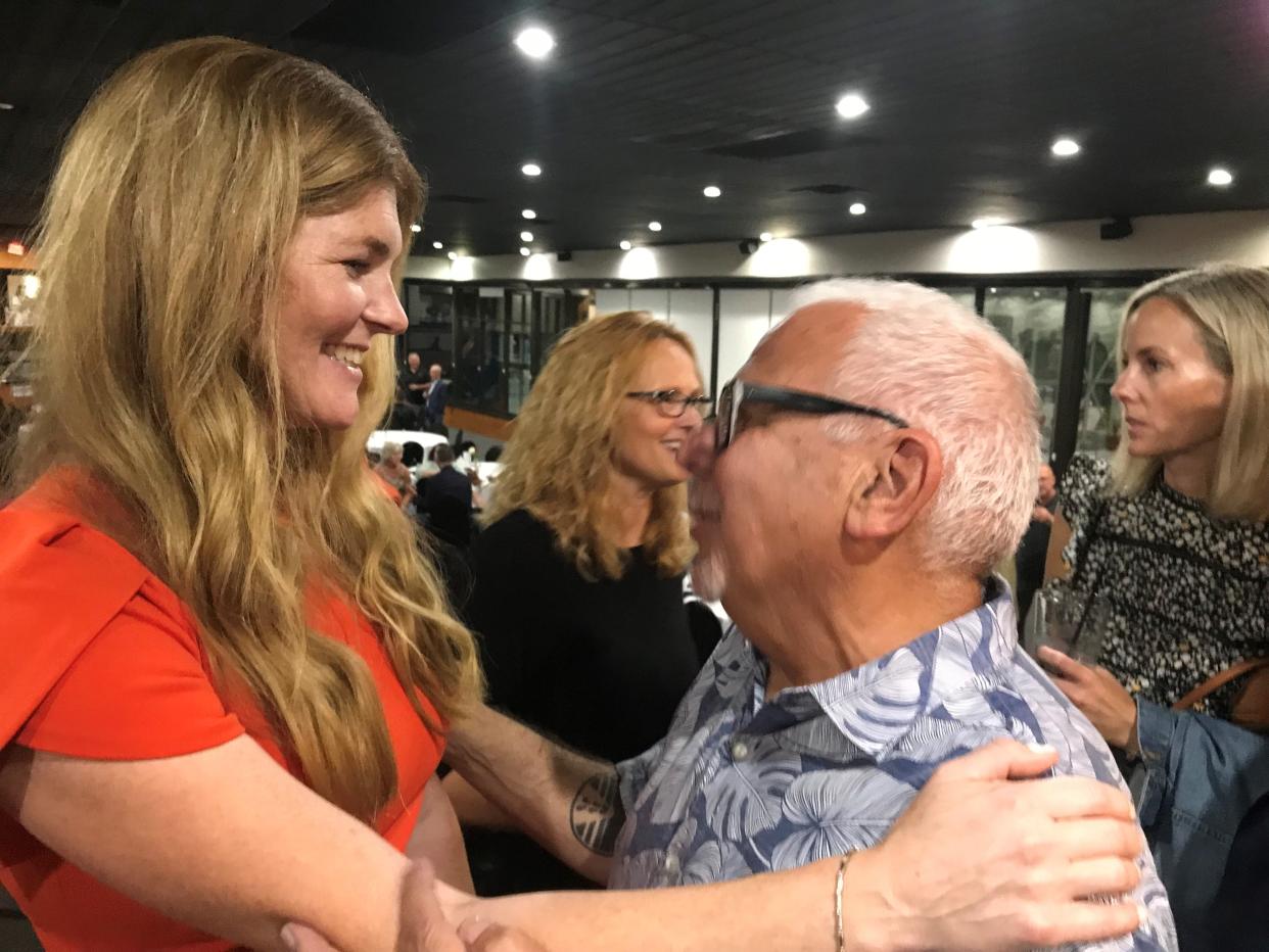 At Deer Lake Athletic Club in Clarkston on July 26, 2023, Mary Patterson, having announced her campaign for Oakland County Executive, greets Fred Nader, 73, of Bloomfield Township, a longtime supporter of Patterson's father, the late L. Brooks Patterson. "We were drinking buddies," Nader told a reporter.