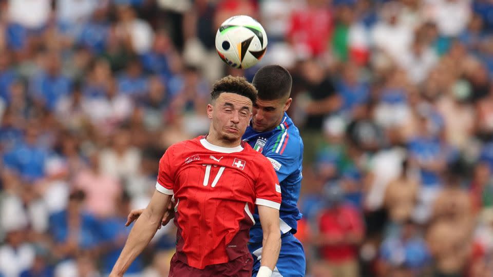  Vargas vies for the ball with Italy's Gianluca Mancini. - Karina Hessland/Reuters