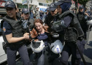 <p>Female police officers detain a woman taking part in May Day protests in Istanbul, Turkey, May 1, 2018. Police detained several demonstrators as the crowd tried to march toward Istanbul’s Taksim Square, which is symbolic as the center of protests in which dozens of people were killed in 1977.(Photo: Lefteris Pitarakis/AP) </p>