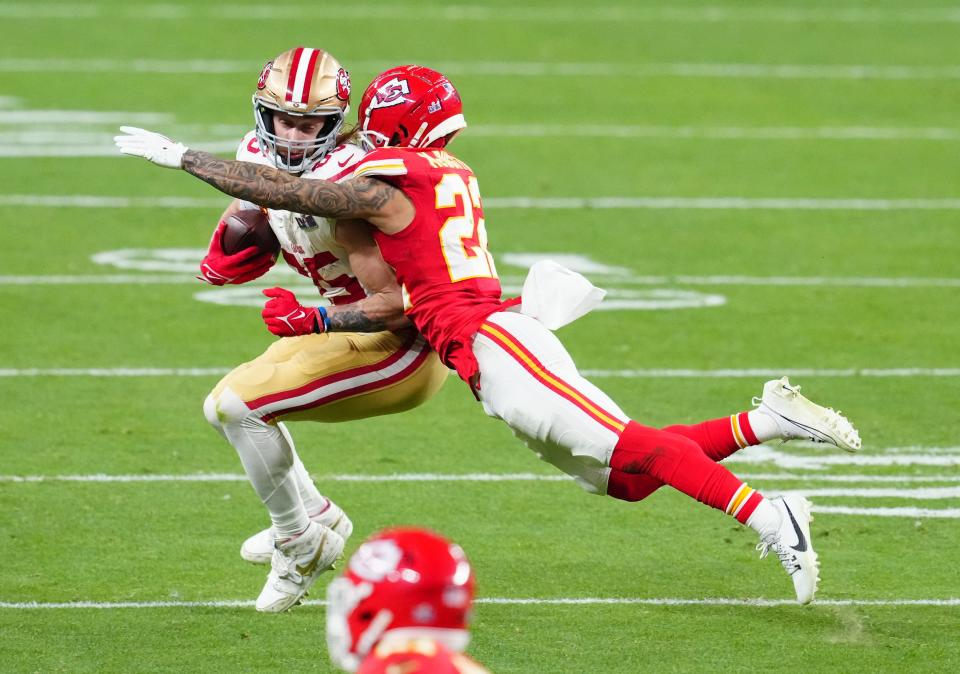 San Francisco 49ers tight end George Kittle (85) catches a pass against Kansas City Chiefs cornerback Trent McDuffie (22) in the fourth quarter in Super Bowl LVIII at Allegiant Stadium.