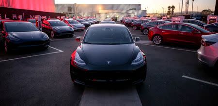 FILE PHOTO: Tesla Model 3 cars are seen as Tesla holds an event at the factory handing over its first 30 Model 3 vehicles to employee buyers at the company’s Fremont facility in California, U.S. on July 28, 2017. Courtesy Tesla/Handout via REUTERS ATTENTION EDITORS - THIS PICTURE WAS PROVIDED BY A THIRD PARTY.