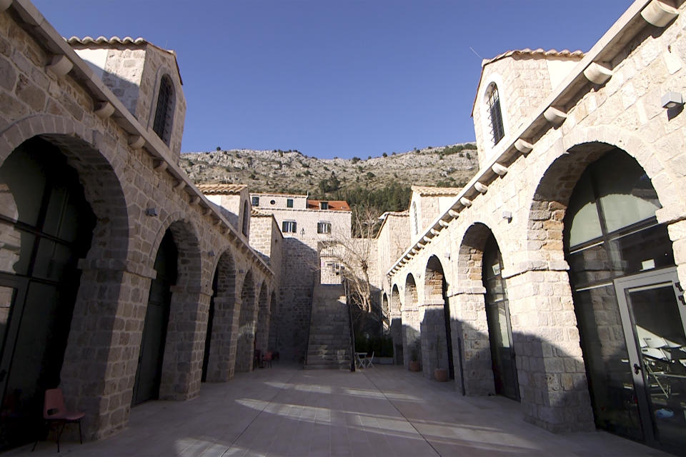 This Tuesday, March 17, 2020 photo shows the Lazarettos complex, called Lazareti in Croatian, in Dubrovnik, Croatia. Just outside the majestic walls of Croatia’s medieval citadel city of Dubrovnik lies a cluster of small stone houses that today serve as an art and clubbing hub. But as the coronavirus spreads across the globe, many are being reminded of the Lazareti complex's original use as an ancient quarantine area that helped keep infectious diseases away. (AP Photo/Darko Bandic)
