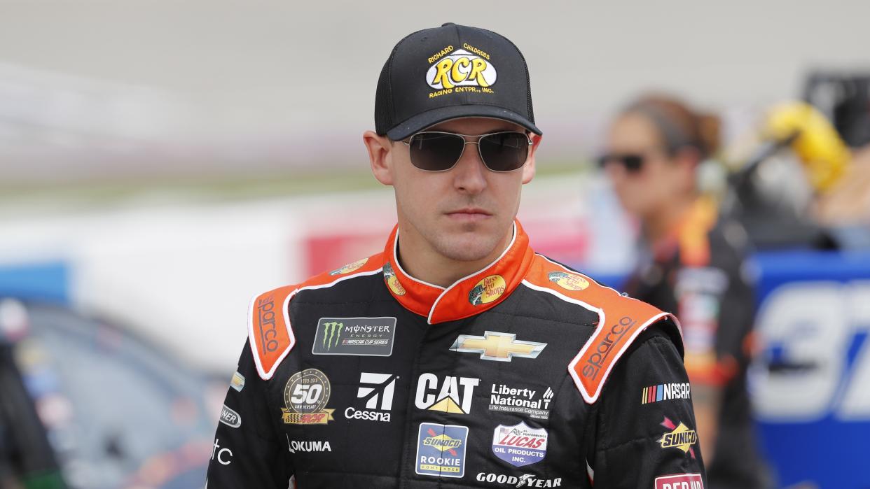 Daniel Hemric walks to his car before qualifying for the NASCAR cup series race at Michigan International Speedway, Saturday, June 8, 2019, in Brooklyn, Mich. (AP Photo/Carlos Osorio)