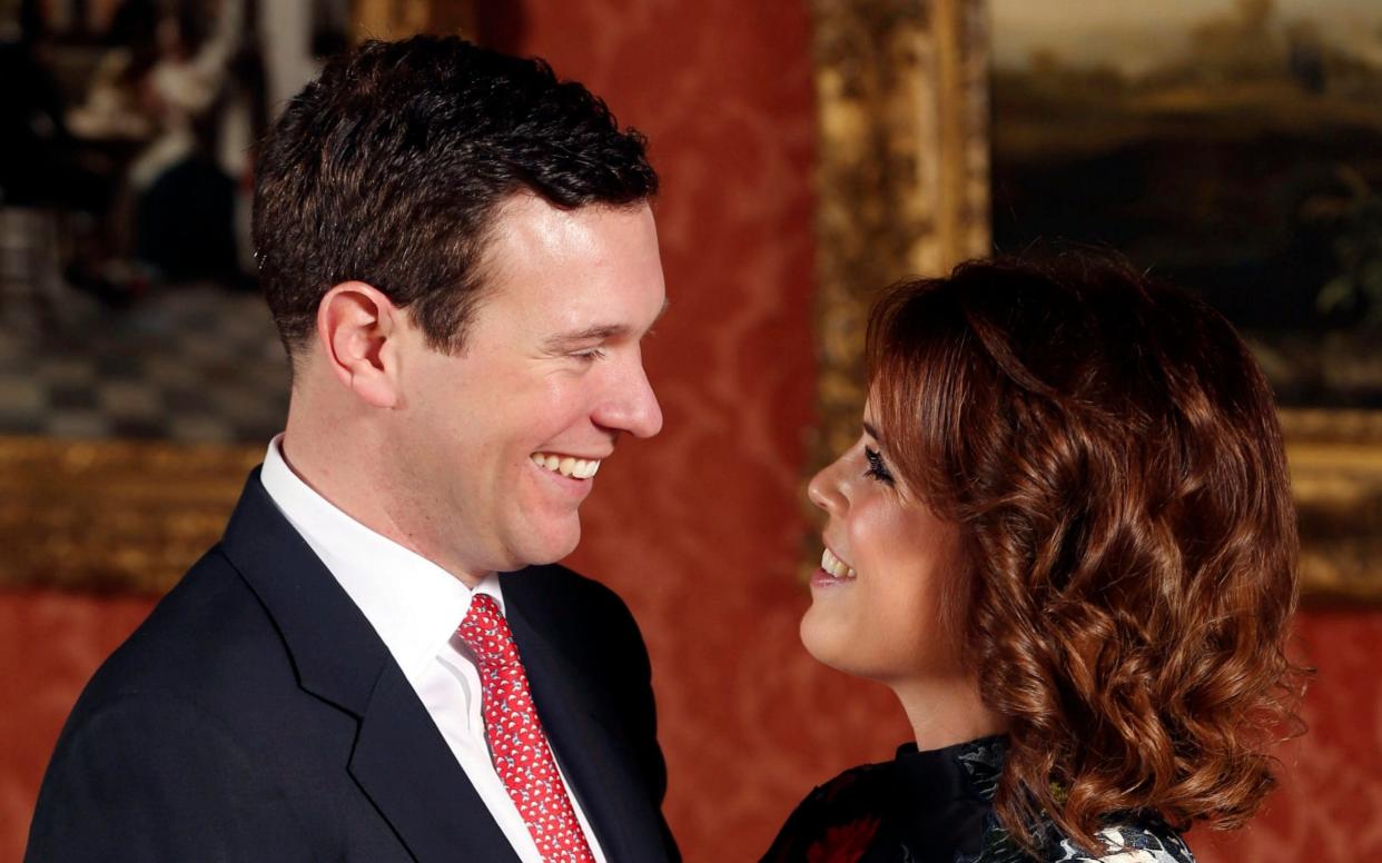Princess Eugenie and Jack Brooksbank pose in the Picture Gallery at Buckingham Palace after they announced their engagement in London - PA pool
