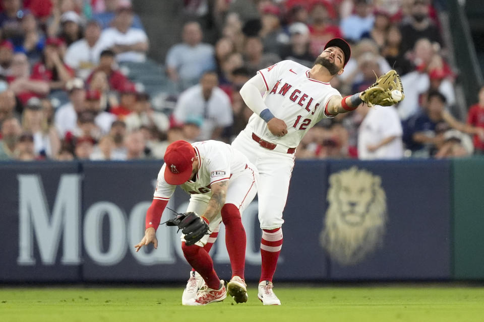 Los Angeles Angels left fielder Kevin Pillar, right, collides with shortstop Zach Neto while catching a fly ball hit by Detroit Tigers' Mark Canha during the sixth inning of a baseball game, Friday, June 28, 2024, in Anaheim, Calif. (AP Photo/Ryan Sun)