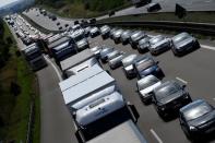 Cars and trucks drive along a motorway near Roth