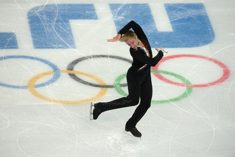 Russia's Yevgeny Plushenko performs in the Men's Figure Skating Team Short Program during the Sochi Winter Olympics on February 6, 2014