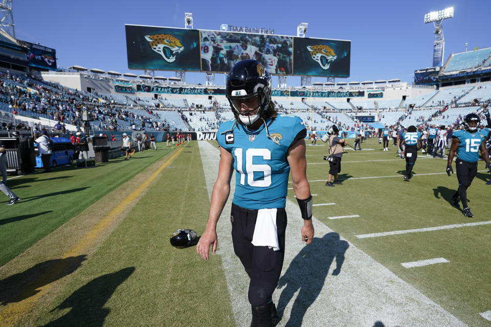 Jacksonville Jaguars quarterback Trevor Lawrence walks off the field after losing 13-6 to the Houston Texans in an NFL football game in Jacksonville, Fla., Sunday, Oct. 9, 2022. (AP Photo/John Raoux)