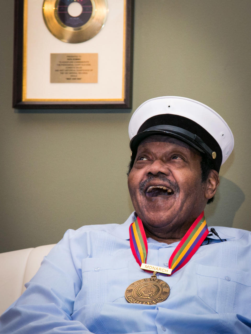 Legendary musician Fats Domino is named "Honorary Grand Marshall" of the Krewe of Orpheus, the star-studded Carnival club that traditionally parades the night before Mardi Gras, Friday, Dec. 20, 2013 in New Orleans. (AP Photo/Doug Parker).