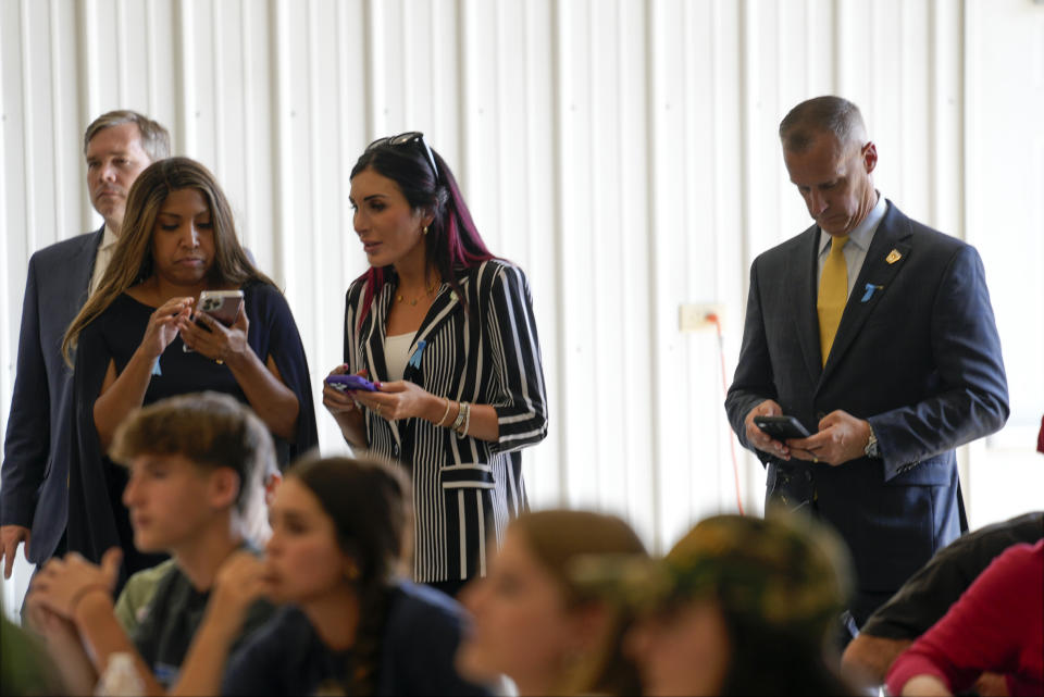 Lynne Patton, Laura Loomer and Corey Lewandowski watch as Republican presidential nominee former President Donald Trump visits the Shanksville Volunteer Fire Company in Shanksville, Pa., Wednesday, Sept. 11, 2024. (AP Photo/Matt Rourke)