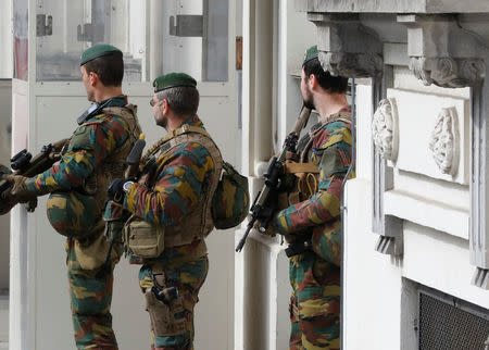 Belgian soldiers keep guard outside the Belgian Parliament in Brussels, Belgium, March 23, 2017. Reuters/Yves Herman