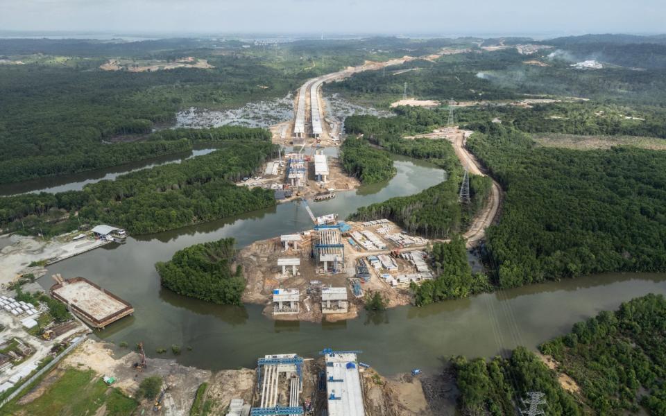 an aerial view of a new toll road, which connects the future Capital City of Nusantara to Balikpapan