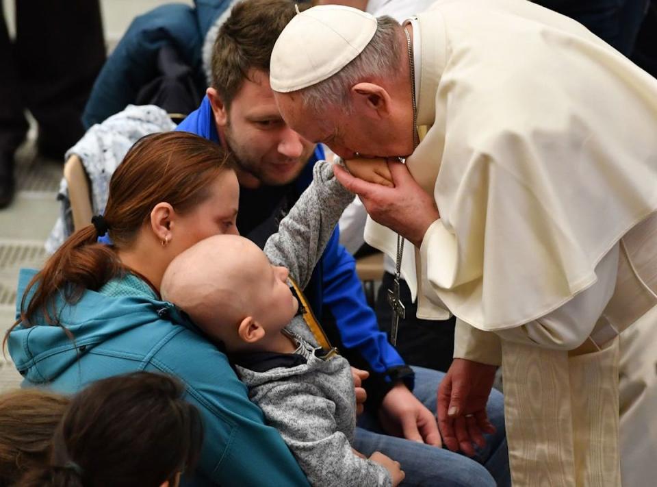 Pope Francis blesses a child attending the weekly general audience at the Vatican in 2019. <a href="https://www.gettyimages.com/detail/news-photo/pope-francis-blesses-a-sick-child-attending-the-weekly-news-photo/1094264400?phrase=%22pope%20francis%20blesses%20a%22&adppopup=true" rel="nofollow noopener" target="_blank" data-ylk="slk:Andreas Solaro/AFP via Getty Images;elm:context_link;itc:0;sec:content-canvas" class="link ">Andreas Solaro/AFP via Getty Images</a>