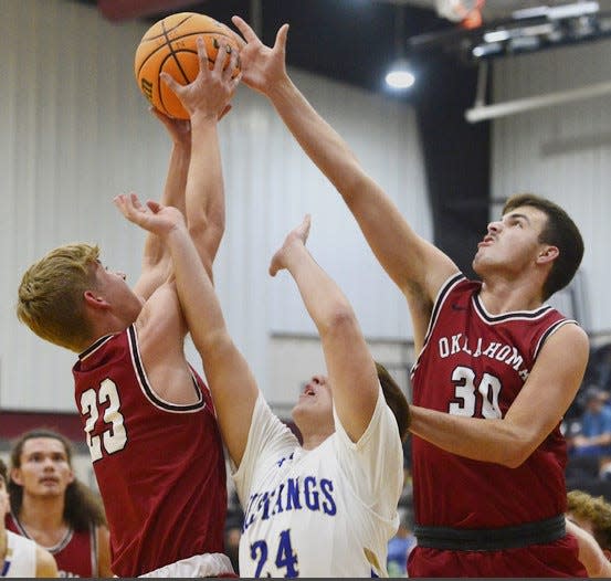 Oklahoma Union's Austin Harris, left, and Levi Krieder, right, swallow up an Oologah player during boys basketball action on Dec. 5, 2022, in the Ty Hewitt tourney in Nowata.