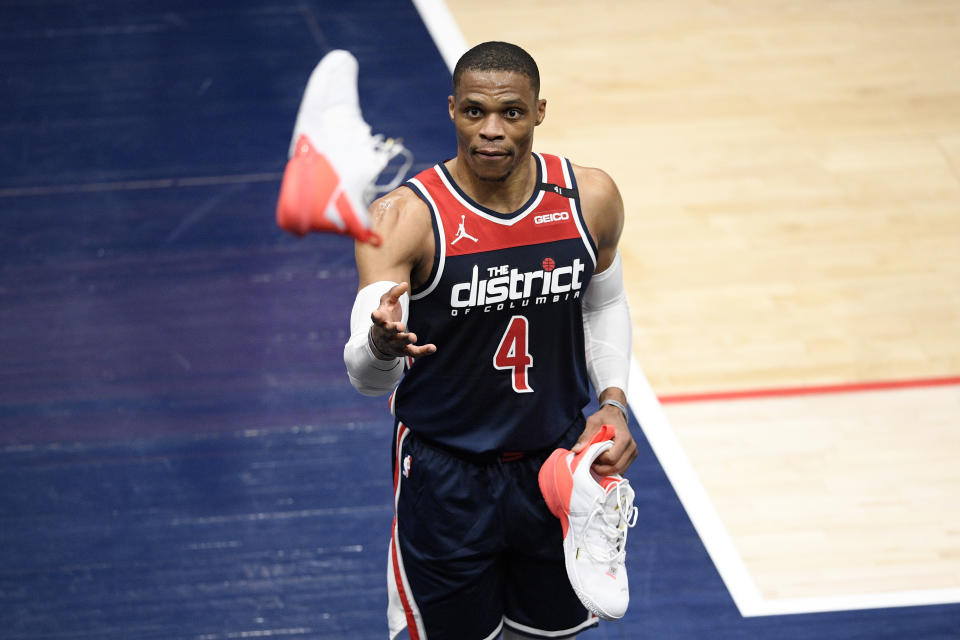 Washington Wizards guard Russell Westbrook throws his shoe into the stands after the team's NBA basketball game against the Cleveland Cavaliers, Friday, May 14, 2021, in Washington.(AP Photo/Nick Wass)