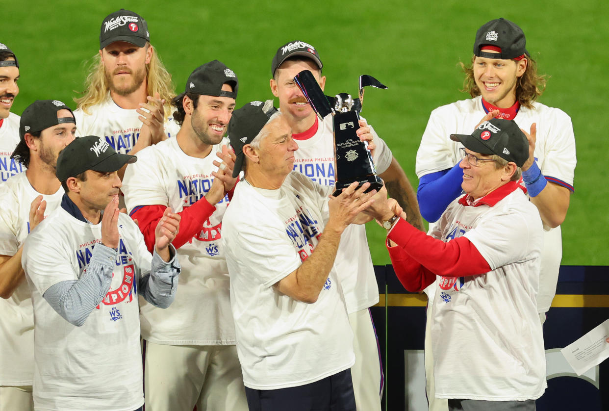 Phillies executive Dave Dombrowski, seen here after winning the NLCS, has brought his trademark win-now mentality to Philadelphia at the behest of team owner John Middleton (right). (Photo by Michael Reaves/Getty Images)