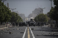 Riot police face supporters of opposition leader and former presidential candidate Ousmane Sonko in Dakar, Senegal, Monday, March 8, 2021. Senegalese authorities have freed opposition leader Ousmane Sonko while he awaits trial on charges of rape and making death threats. The case already has sparked deadly protests threatening to erode Senegal's reputation as one of West Africa’s most stable democracies. (AP Photo/Sylvain Cherkaoui)