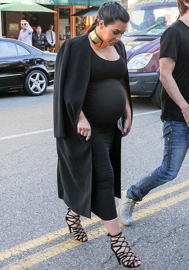 Kim was regularly seen squeezing her feet into tight shoes during her pregnancies. Source: Getty