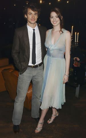 <p>Dave Benett/Getty</p> Hugh Dancy and Anne Hathaway at the 2004 Ella Enchanted premiere