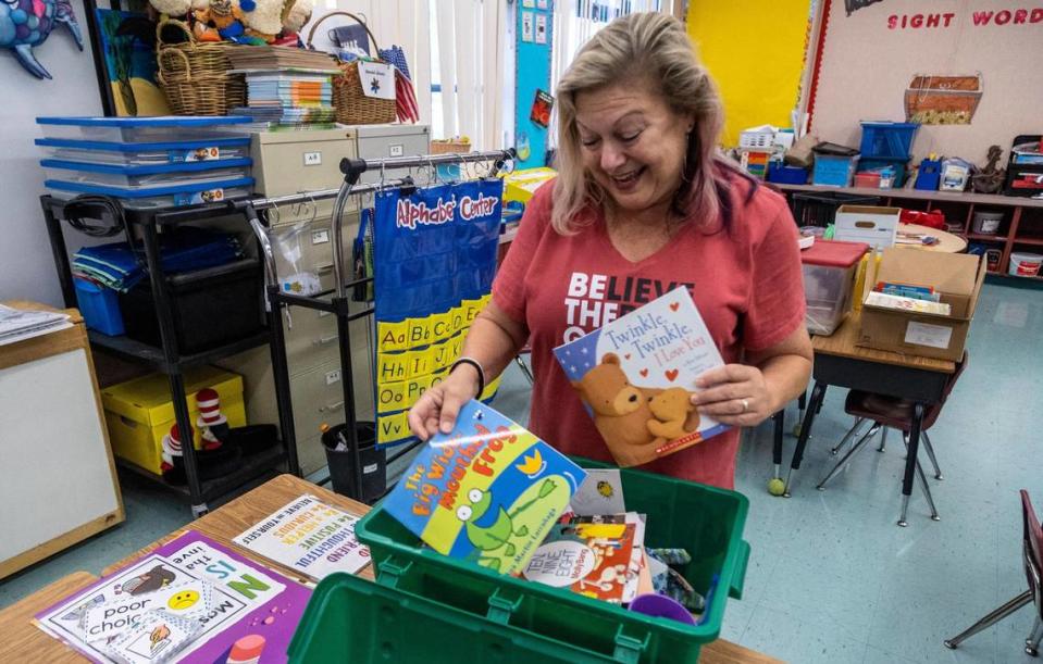 Denise Soufrine looks through her treasure chest as she prepares for Tuesday’s first day of classes at Pembroke Pines Elementary.