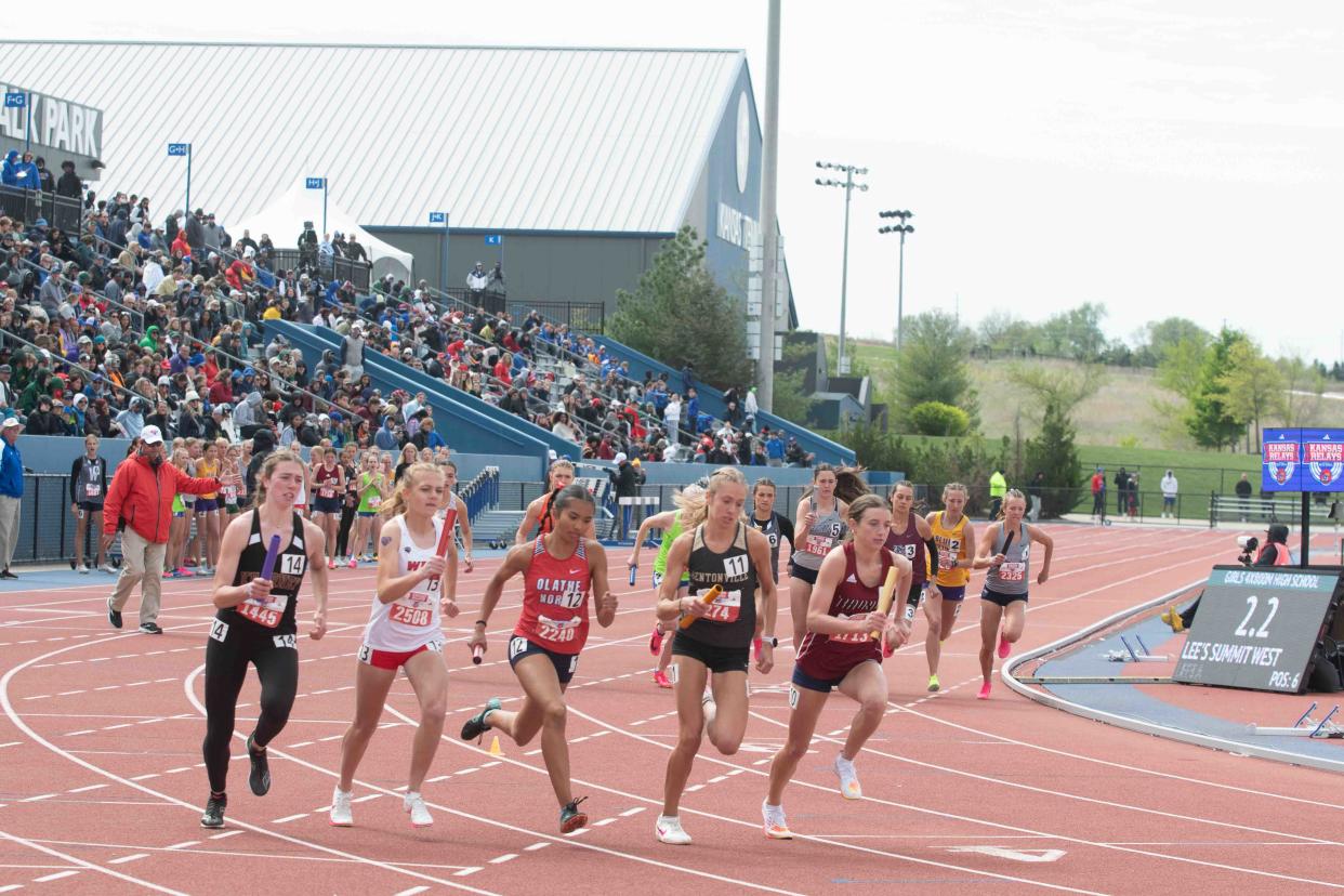 High school athletes competes in the girls 4x800 meter relay at the Kansas Relays in April in Lawrence.