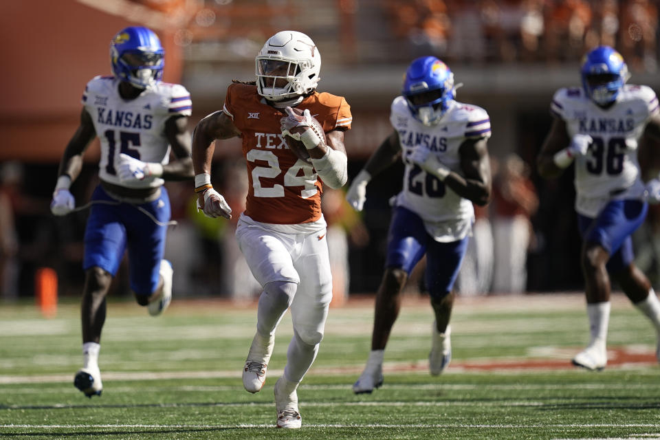 Texas running back Jonathon Brooks (24) breaks away for a touchdown run against Kansas during the second half of an NCAA college football game in Austin, Texas, Saturday, Sept. 30, 2023. (AP Photo/Eric Gay)