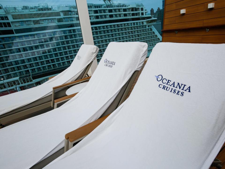 Pool chairs on the Oceania Vista