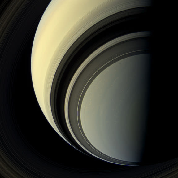 The spectacular rings of Saturn cast dark shadows on the ringed planet as the winter season approaches in Saturn's southern hemisphere in this view from the Cassini spacecraft. With the cold season comes a blue hue on Saturn that is likely caus