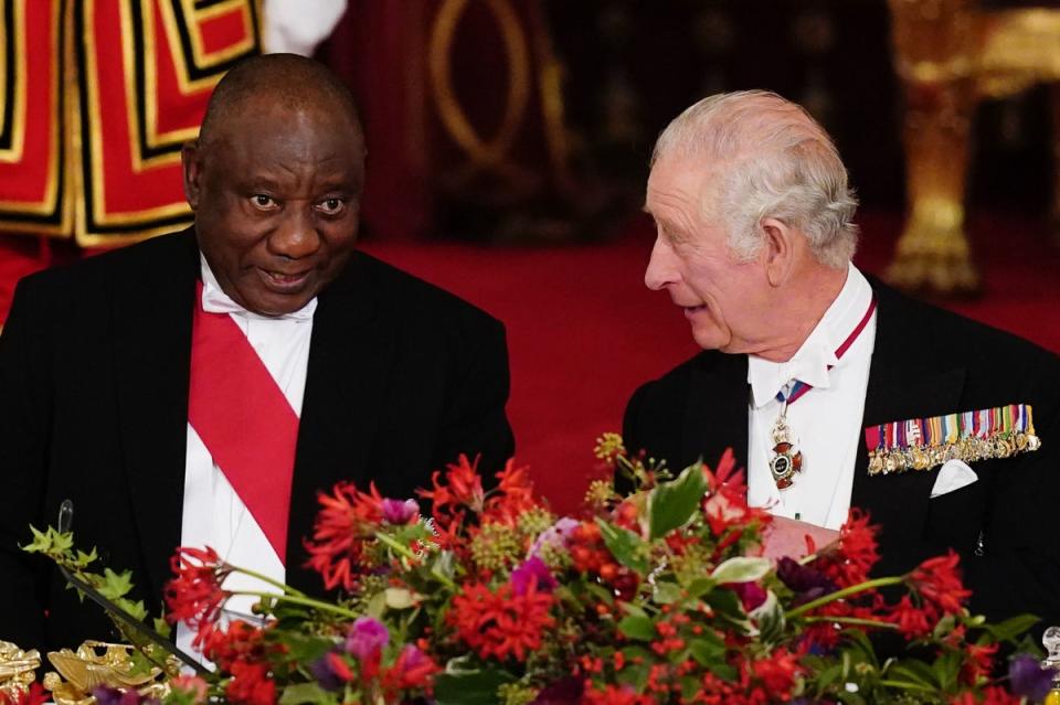 President Cyril Ramaphosa of South Africa, and King Charles III, sit together at the State Banquet held at Buckingham Palace on November 22 (PA)