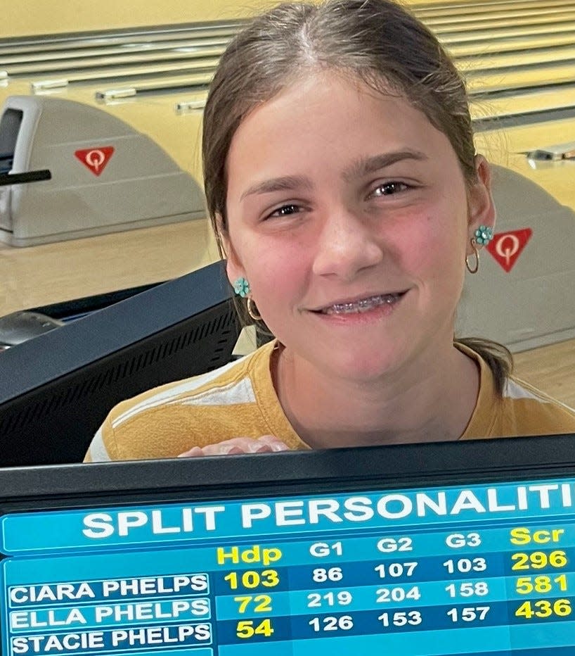 Ella Phelps holds the sign which shows her games when she rolled her 581 series last week at Sunset Lanes. A student at Tonaquint Intermediate School, Phelps bowls in the youth bowling league on Saturday mornings.