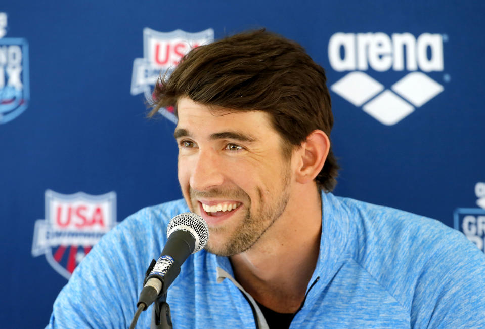 Michael Phelps speaks to the media after practice, Wednesday, April 23, 2014, in Mesa, Ariz. Phelps is competing in the Arena Grand Prix at Mesa on Thursday as he returns to competitive swimming after a nearly two-year retirement. (AP Photo/Matt York)