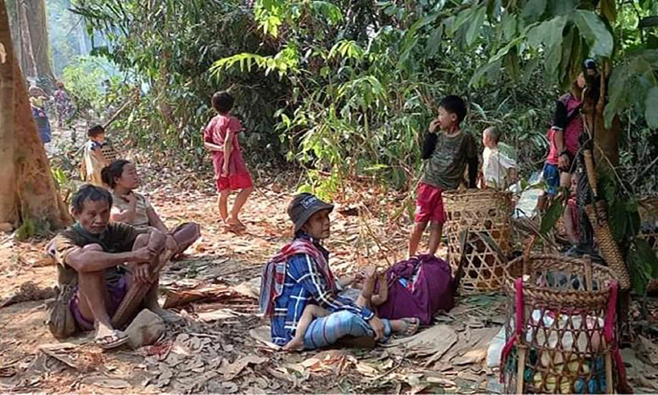 In this photo released by the Free Burma Rangers, Karen villagers gather in the forests as they hide from military airstrikes in the Deh Bu Noh area of the Papun district, north Karen state, Myanmar, Sunday, March 28, 2021. Thai authorities along its northwestern border braced themselves, Monday, for a possible influx of more ethnic Karen villagers fleeing the fear of renewed air strikes from the Myanmar military. (Free Burma Rangers via AP)