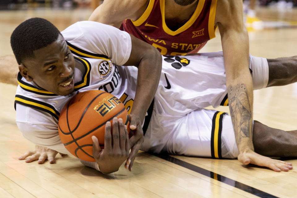 Missouri's D'Moi Hodge grabs the ball before going out of bounds during the second half of an NCAA college basketball game against Iowa State, Saturday, Jan. 28, 2023, in Columbia, Mo. Missouri won 78-61.(AP Photo/L.G. Patterson)