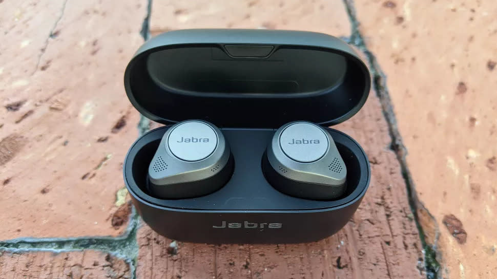 The Jabra Elite 85t sitting on a brick floor