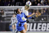 UCLA's Sunshine Fontes (50) and Alabama's Macy Clem (2) try to head the ball during the first half of an NCAA women's soccer tournament semifinal in Cary, N.C., Friday, Dec. 2, 2022. (AP Photo/Karl B DeBlaker)