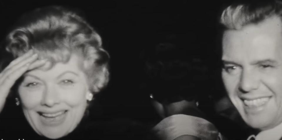Lucille Ball and Desi Arnaz laugh at an event in the "Lucy and Desi" trailer