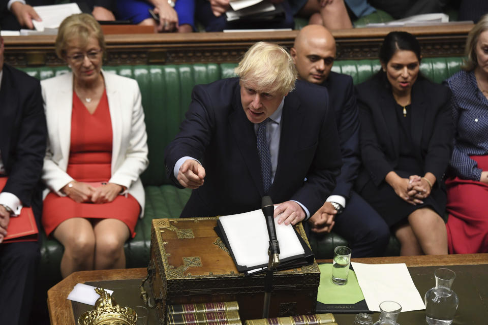 In this handout photo provided by the House of Commons, Britain's Prime Minister Boris Johnson speaks in Parliament in London, Wednesday, Sept. 25, 2019. An unrepentant Prime Minister Boris Johnson brushed off cries of “Resign!” and dared the political opposition to try to topple him Wednesday at a raucous session of Parliament, a day after Britain’s highest court ruled he acted illegally in suspending the body ahead of the Brexit deadline. (Jessica Taylor/House of Commons via AP)