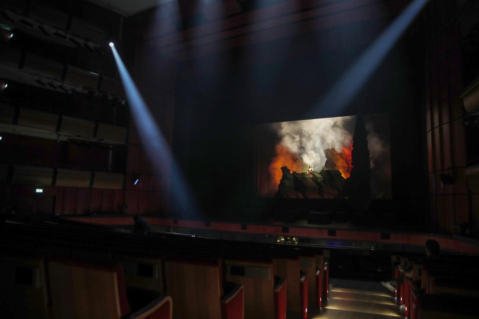 Greek soprano Artemis Bogri sings during a rehearsal of "Despo-Greek Dances" Opera and dance performance in Athens, Thursday, March 4, 2021. Dozens of museum exhibitions, theater productions, discussion panels and historical re-enactments were planned in Greece for this year to commemorate the bicentennial of the 1821-1832 Greek War of Independence. But due to the coronavirus pandemic, mezzo-soprano Artemis Bogri and her fellow singers stepped onstage in an empty theater to perform the Greek National Opera’s new production of “Despo,” one of the events marking 200 years since the war that resulted in Greece’s independence from the Ottoman Empire and rebirth as a nation. (AP Photo/Thanassis Stavrakis)