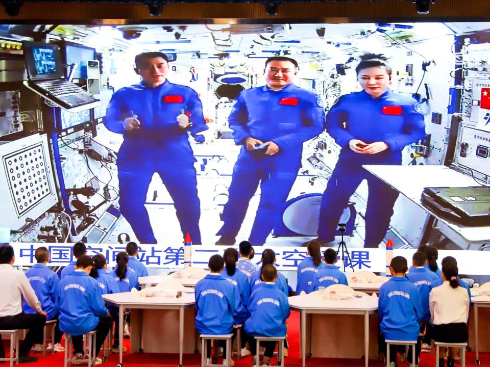 China said it's sending a new batch of astronauts in the coming days to space station Tiangong as it nears completion. Here, students watch a televised lecture by three astronauts currently on Tiangong on March 23, 2022.