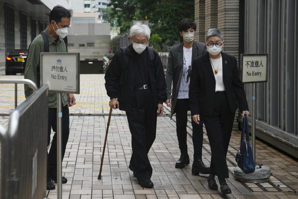 From left, Hong Kong scholar Hui Po-keung, Catholic Cardinal Joseph Zen, singer Denise Ho and barrister Margaret Ng arrive for an appearance at a court in Hong Kong as they were charged in relation to their past fundraising for activists, Tuesday, May 24, 2022. (AP Photo/Kin Cheung)