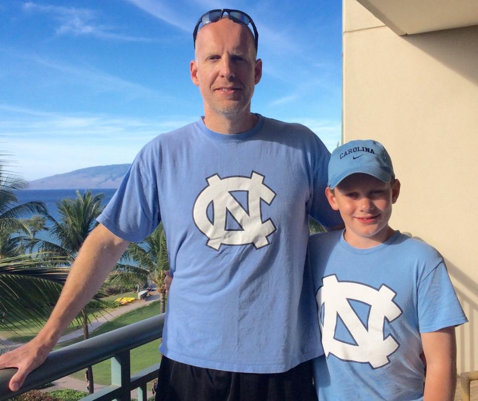 Brian Masterson (left) and his son Luke, a Franklin Road Academy offensive tackle, pose on the balcony of their hotel during the 2016 Maui Invitational in Hawaii. As North Carolina Tar Heel fans, the Mastersons were there to watch UNC basketball. Luke, a senior at FRA, committed to the Tar Heels in April.