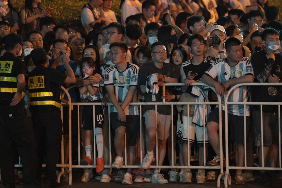 Chinese fans wait to catch a glimpse of superstar Lionel Messi and other members of the Argentina national soccer team to return to their hotel in Beijing, Monday, June 12, 2023. Argentina is scheduled to play Australia in a friendly match in China's capital on Thursday. (AP Photo/Ng Han Guan)