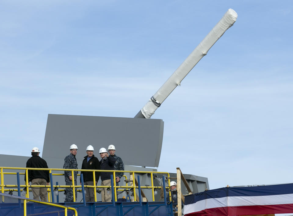 FILE - In a Thursday, Nov. 21, 2013 file photo, Defense Secretary Chuck Hagel, center, tours the Zumwalt destroyer at Bath Iron Works during his first visit to Maine since being confirmed, in Bath, Maine. The skipper of the technology-laden Zumwalt Capt. James Kirk’s futuristic-looking vessel sports cutting-edge technology, new propulsion and powerful armaments, but this ship isn’t the Starship Enterprise. The technology-laden Zumwalt taking shape at Maine’s Bath Iron Works is unlike any other U.S. warship. (AP Photo/Robert F. Bukaty, FIle)